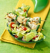 Saffron fish skewers with a mixed salad