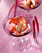 Prawns and radish slices in cocktail glasses