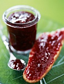 Raspberry jam on a slice of bread