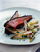 Beef fillet with black sesame seed crust and pan-fried chicory