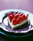 Portion of strawberry tart with cream base