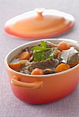 Beef and carrot stew in a casserole dish