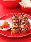 Stuffed mini tomatoes filled with aubergine and caraway seeds