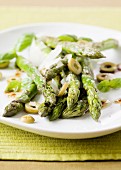 Fried asparagus with green olives and Parmesan cheese