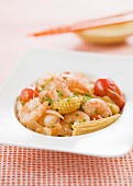Prawns with baby corn cobs and tomatoes