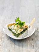 Slice of spinach and goat's cheese savoury tart