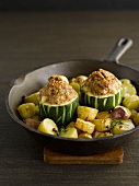 Stuffed zucchinis with walnuts and pan-fried potatoes
