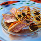 Red mullet fillet with tapenade (black olive paste) and potato lattice