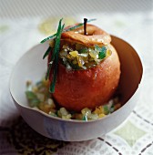 A baked apple with candied fruits and angelica