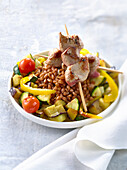 Summer spelt Couscous with lamb skewers