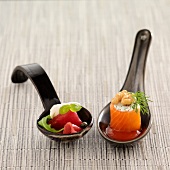 "Spoonful of beef with rocket ; Spoonful of smoked salmon,ricotta and tomato puree"