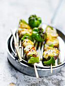 Marinated fish with curry and green pepper skewers