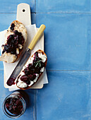 Chicken and goat's cheese with bilberry and grape jam on sliced bread