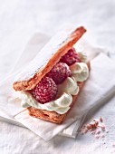 Biscuits rose de Reims with cream and raspberries
