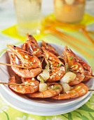 Shrimp kebabs with small onions and garlic