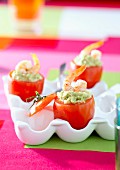 Tomatoes stuffed with guacamole and shrimps