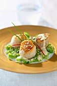 Roasted scallops with mandarin butter and thinly chopped leeks