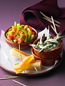 Tomato and green pepper salad ,marinated anchovies, and cheese with fruit paste