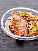 Chicken breast with crisp skin and spaghetti-shaped vegetables