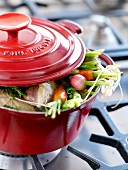 Stringed roast beef with vegetables in a casserole dish