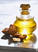 Bottle of argan oil and argan nuts