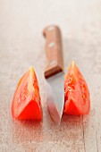 Sliced tomato and knife