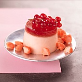 Panna cotta wwith red jelly, red currants and strawberry sweets