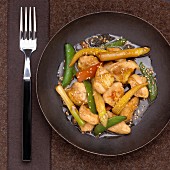 Landes chicken and vegetables cooked in a wok