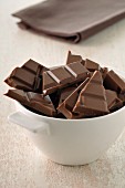 Squares of chocolate in a bowl
