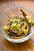 Seaweed spaghettis with black sesame seeds, soba and romanesco cabbage