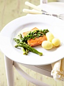 Salmon steak with green asparagus,herbs and steam-cooked potatoes