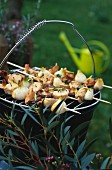Veal,chicken,spring onion,shiitake and fresh thyme brochettes on the barbecue