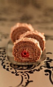 Chocolate and raspberry rolled log cake