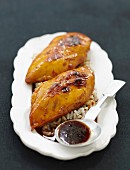 Pan-seared chicken breasts with orange and saffron, rice
