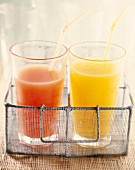 Glass of grapefruit juice and glass of orange juice