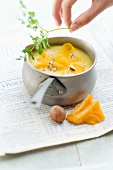 Parsnip soup with mimolette and crushed hazelnuts