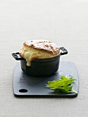 Cheese soufflé served in a small casserole dish