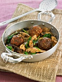 Seitan balls with spinach and mushrooms