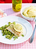 Grilled pollock with lemon and spicy peas