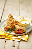 Grilled pieces of chicken with parmesan sauce