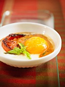 Baked egg with garlic and tomato