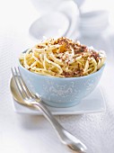 Spaghetti with chocolate flakes and powdered coconut