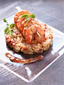 Gambas brochette and mashed potatoes mixed with confit tomatoes