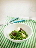 Peas and onions with Botifarra sausage