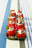 Small raw tomatoes stuffed with roquefort cream and almonds