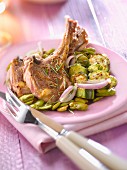 Lamb chops with rosemary,pan-fried fava beans and zucchinis
