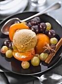 Spicy plum and black and white grape fruit salad with cinnamon ice cream