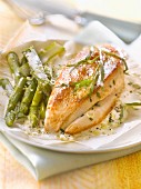 Chicken breast and green asparagus cooked in wax paper with foamy tarragon and citronella sauce