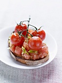 Crushed tomatoes, celery and cherry tomatoes on toast