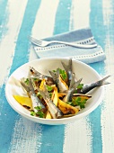 Sardines marinated in orange with roasted mango